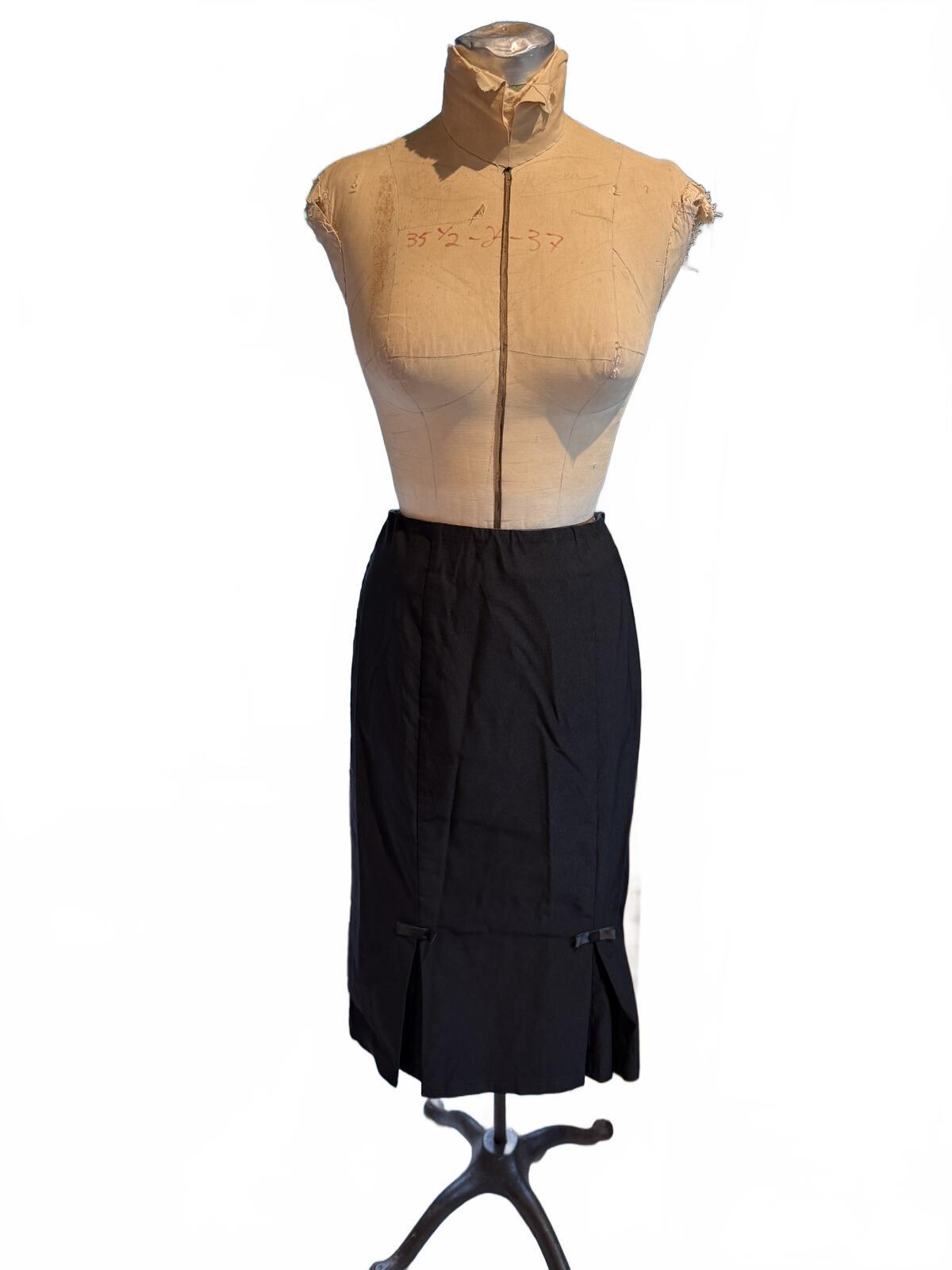 Belle Pogue Black Midi Pencil Skirt with Front Slits and Bow Detail