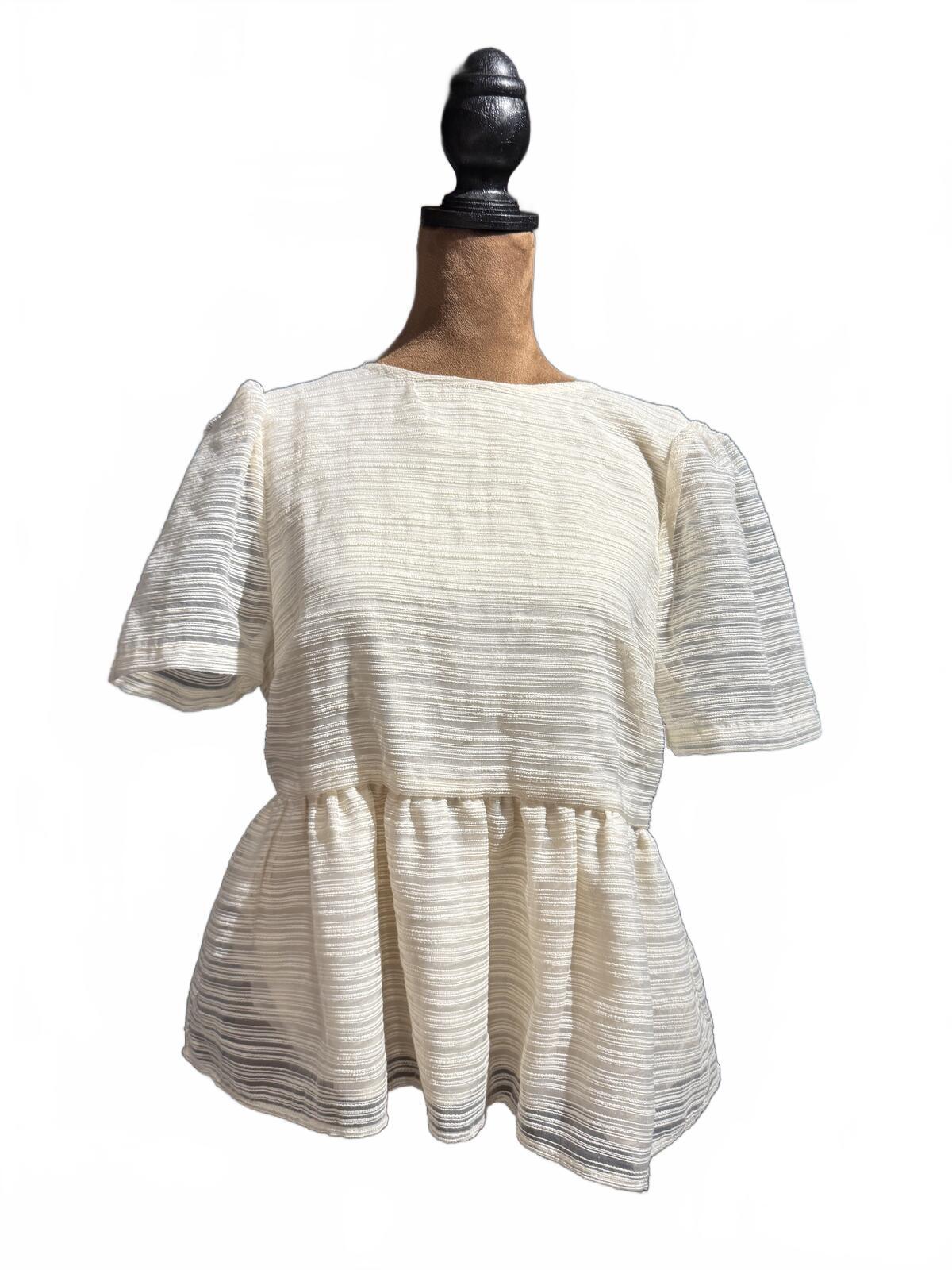 Sunday in Brooklyn Cream Textured Peplum Top with Black Sheer Bow Back