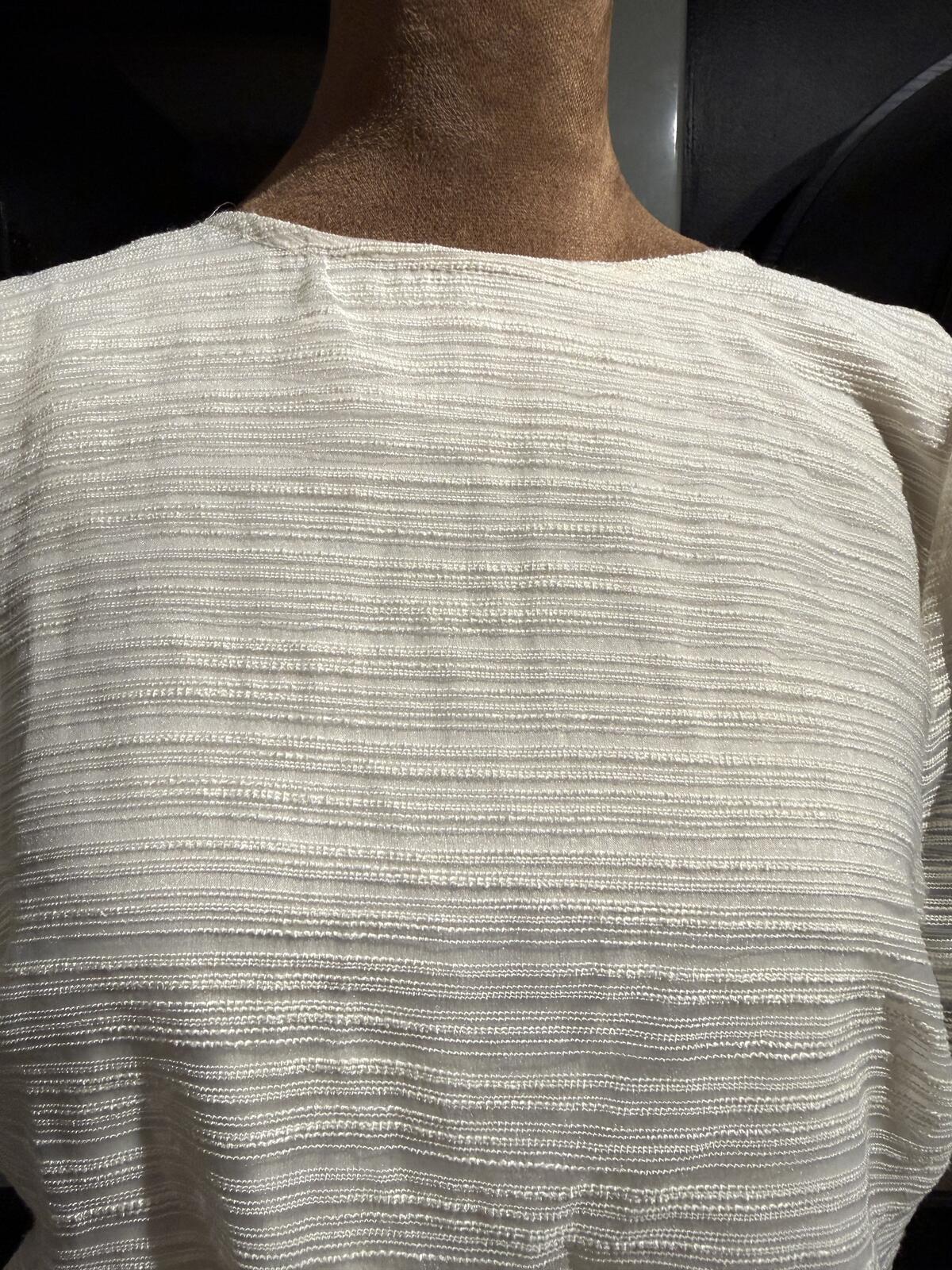 Sunday in Brooklyn Cream Textured Peplum Top with Black Sheer Bow Back