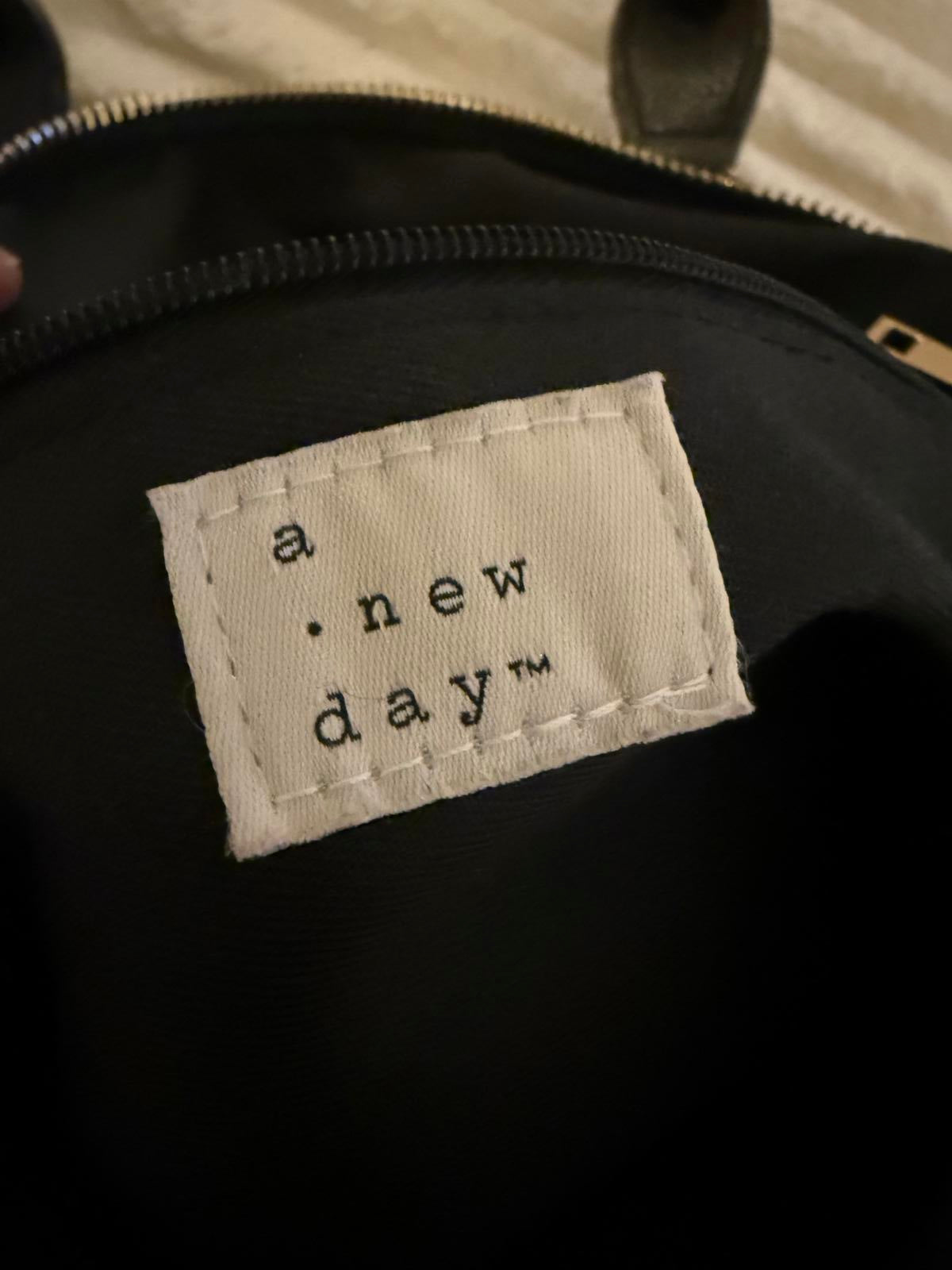 A New Day Black Handbag with Dual Handles and Adjustable Strap